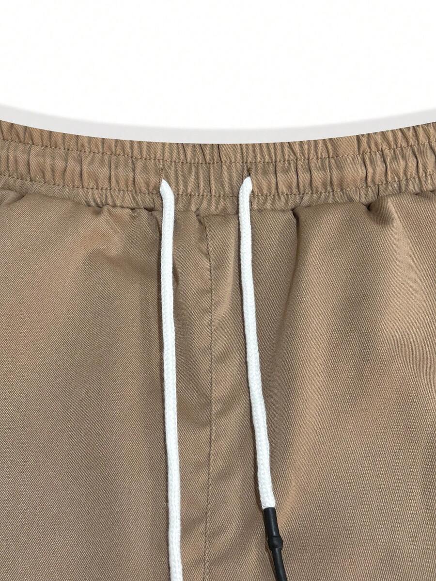 Pánské jogger kalhoty s elastickým pasem, bočními kapsami a lehkou tkaninou