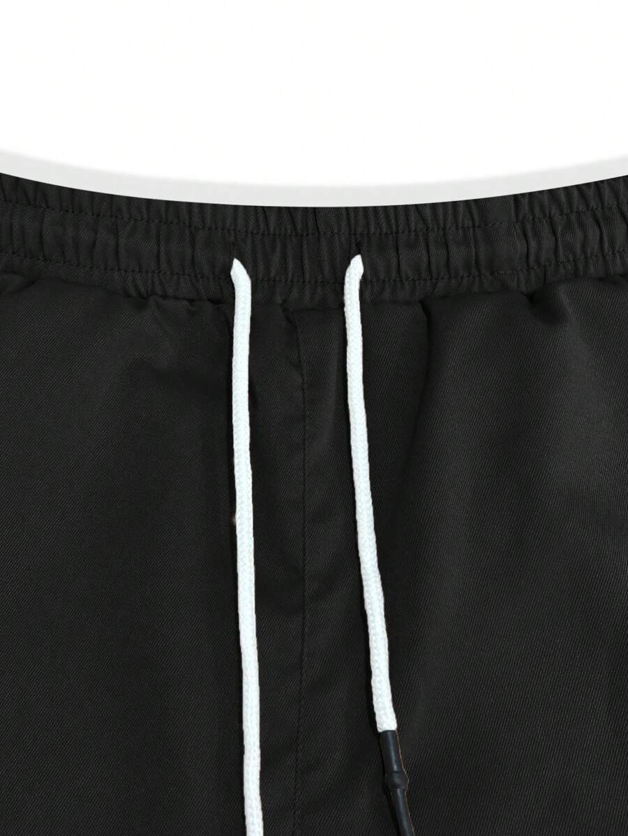 Pánské jogger kalhoty s elastickým pasem, bočními kapsami a lehkou tkaninou