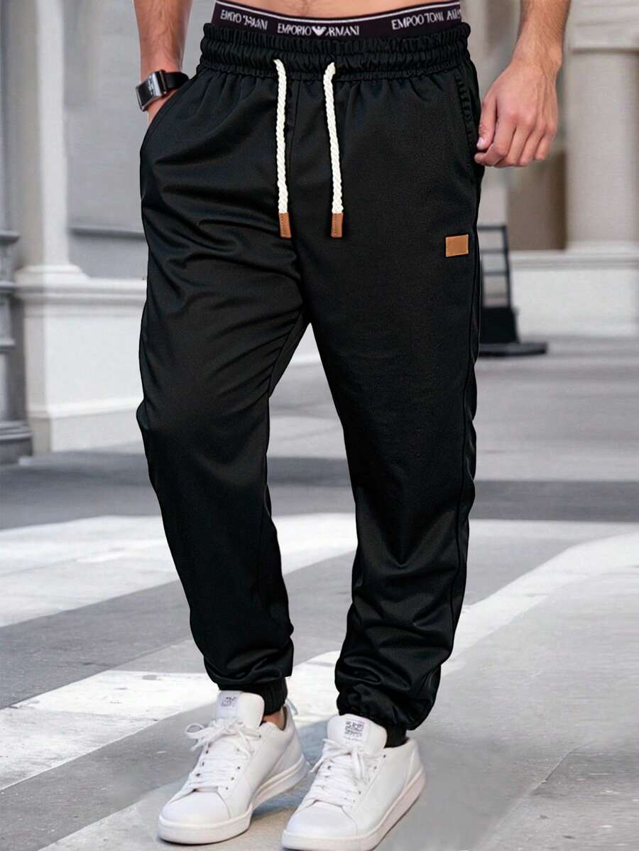 Pánské jogger kalhoty s elastickým pasem, bočními kapsami a lehkou tkaninou