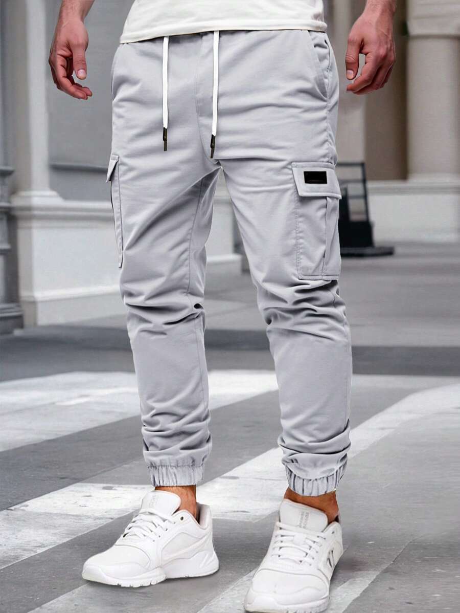 Pánské jogger kalhoty s elastickým pasem, bočními kapsami a lehkou tkaninou
