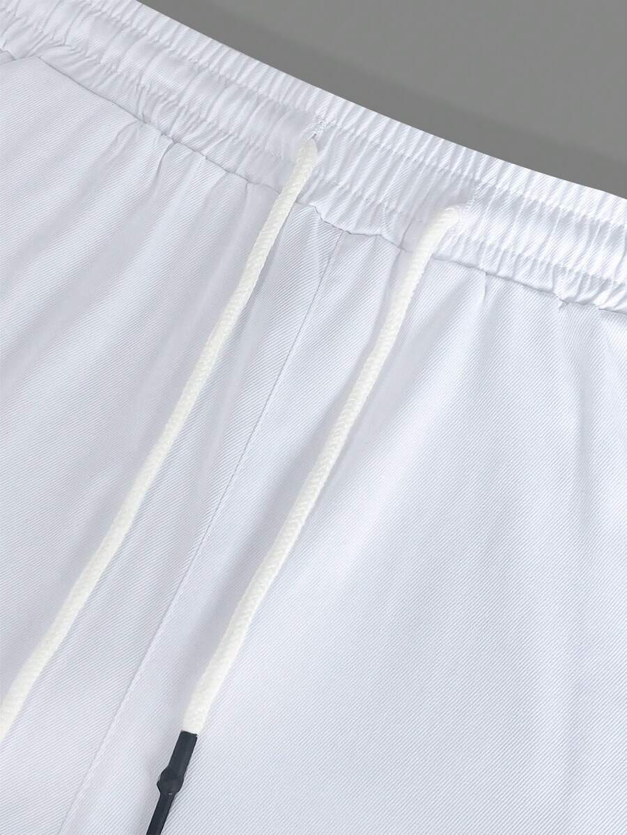 Pánské jogger kalhoty s elastickým pasem, bočními kapsami a lehkou tkaninou