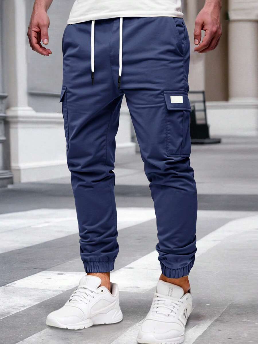 Pánské jogger kalhoty s elastickým pasem, bočními kapsami a lehkou tkaninou