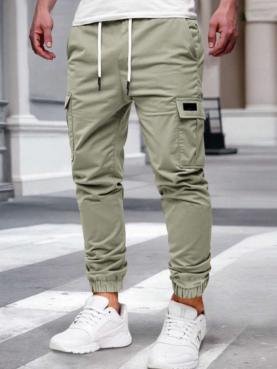 Pánské jogger kalhoty s elastickým pasem, bočními kapsami a lehkou tkaninou