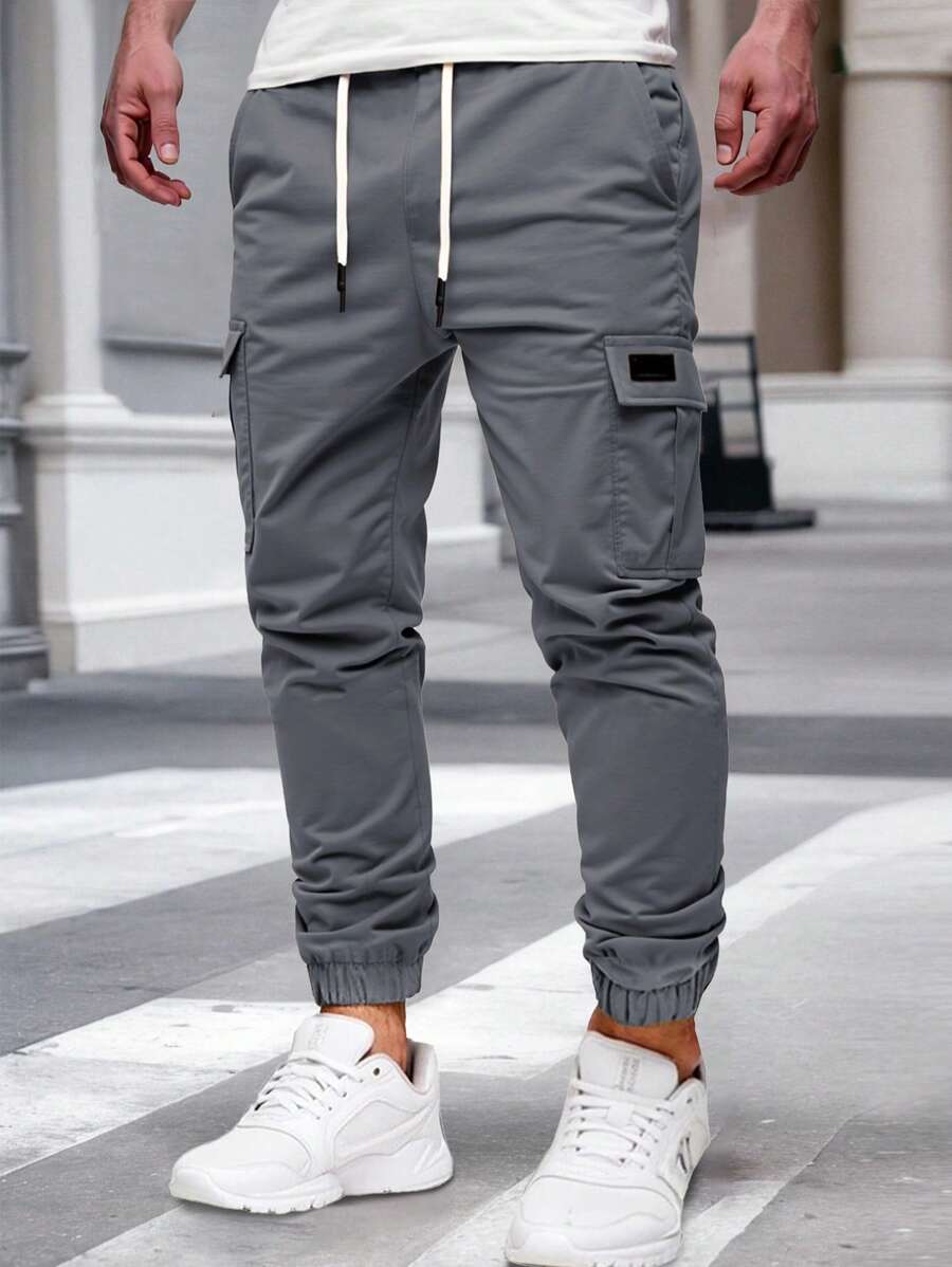Pánské jogger kalhoty s elastickým pasem, bočními kapsami a lehkou tkaninou