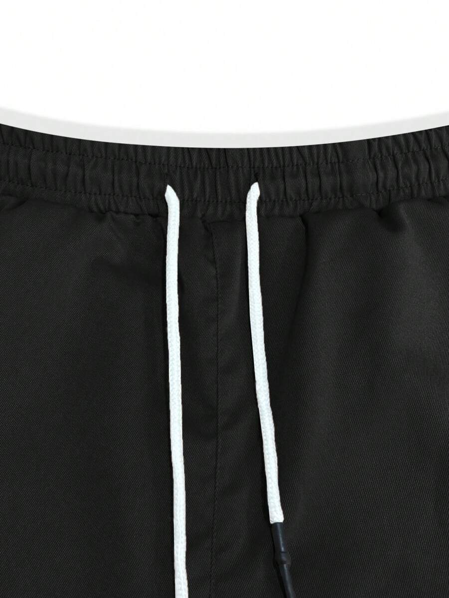 Pánské jogger kalhoty s elastickým pasem, bočními kapsami a lehkou tkaninou