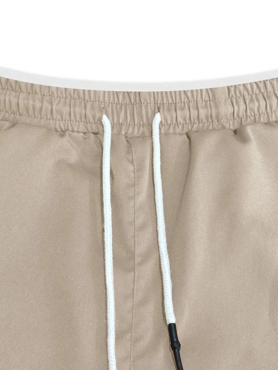 Pánské jogger kalhoty s elastickým pasem, bočními kapsami a lehkou tkaninou