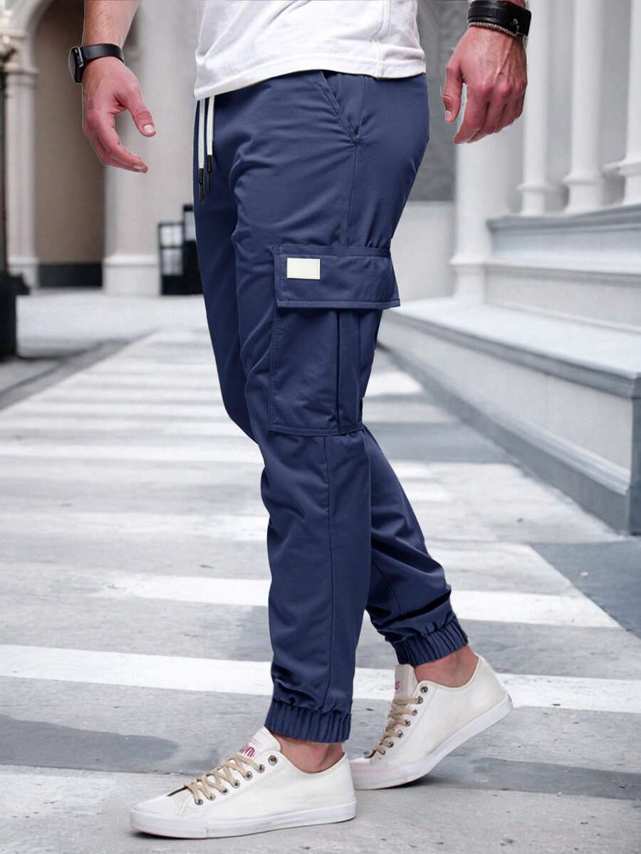 Pánské jogger kalhoty s elastickým pasem, bočními kapsami a lehkou tkaninou