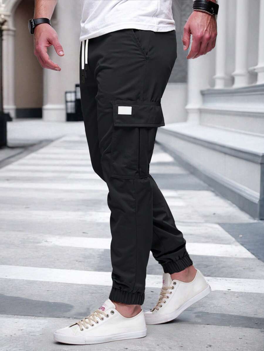 Pánské jogger kalhoty s elastickým pasem, bočními kapsami a lehkou tkaninou