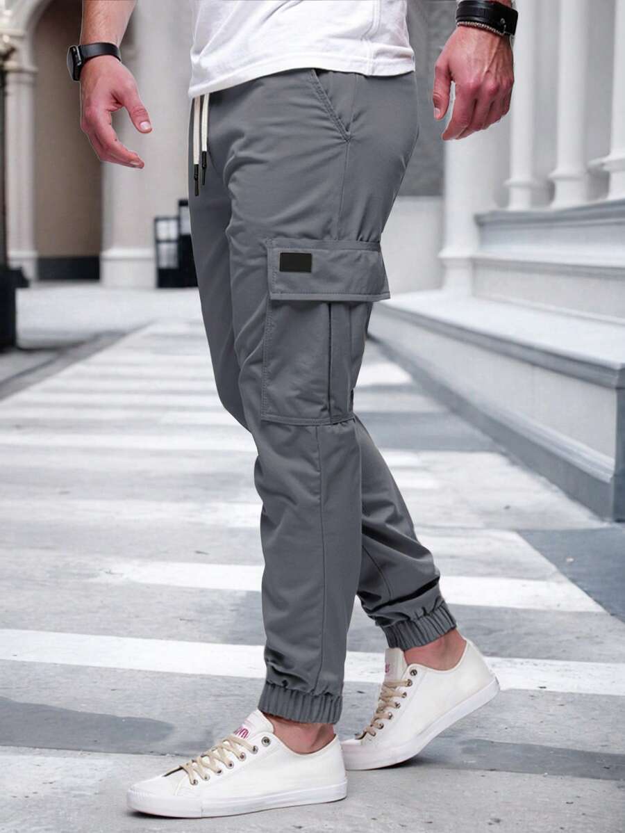 Pánské jogger kalhoty s elastickým pasem, bočními kapsami a lehkou tkaninou