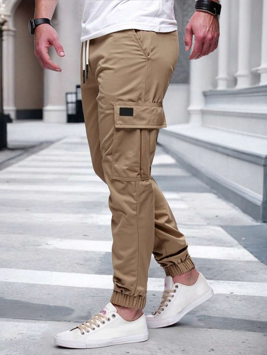 Pánské jogger kalhoty s elastickým pasem, bočními kapsami a lehkou tkaninou