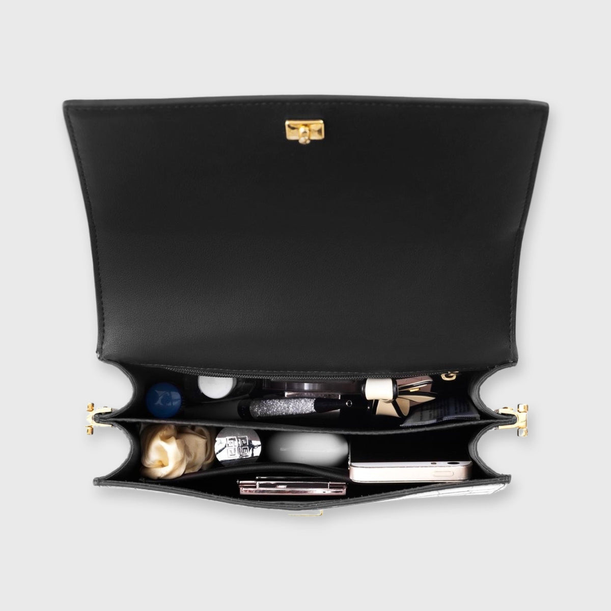 Bolso de mujer: estampado de cocodrilo y cierre con solapa, formato compacto y elegante