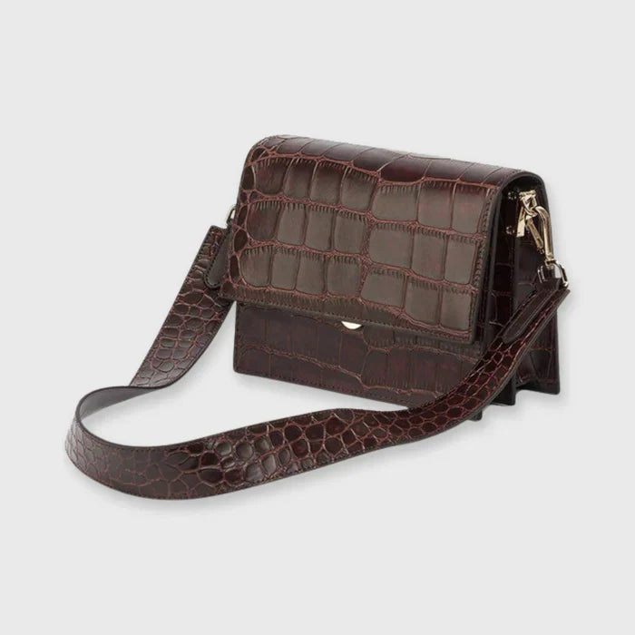 Bolso de mujer: estampado de cocodrilo y cierre con solapa, formato compacto y elegante
